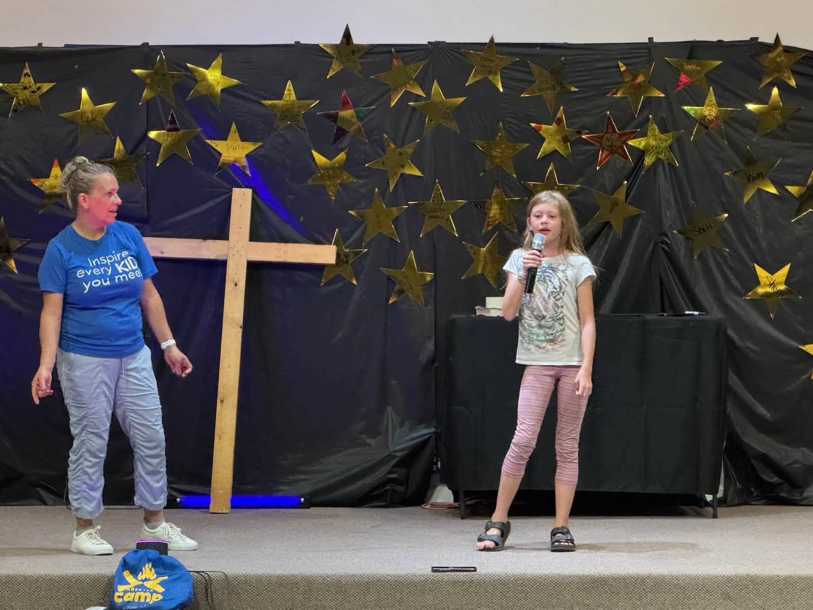 Camper speaking on stage at Greater Camp